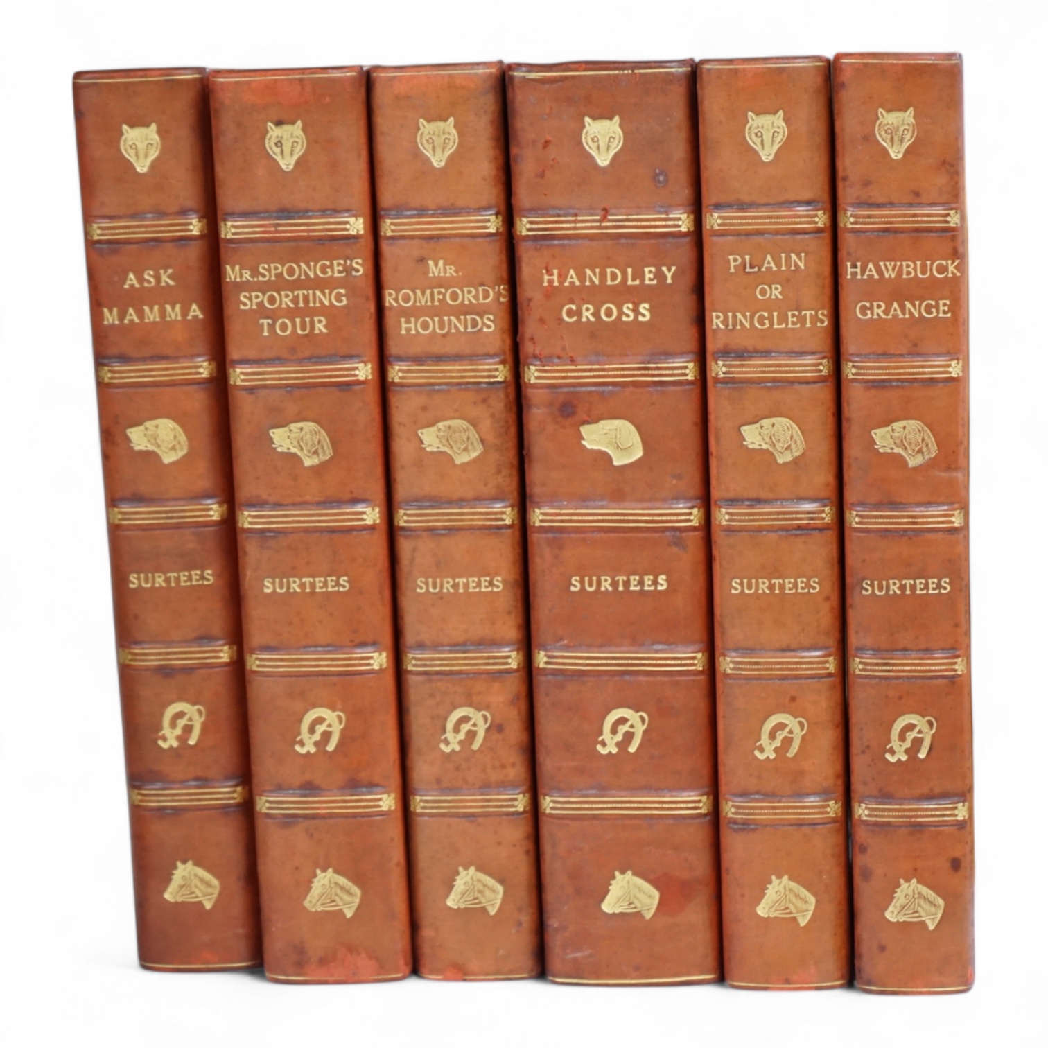 [Surtees, R.S.] Sporting Novels. 6 vols. hand coloured pictorial titles and plates, other text illus.; contemp. red half calf and cloth, gilt pictorial panelled spines, gilt tops and marbled e/ps., med. 8vo. printed for